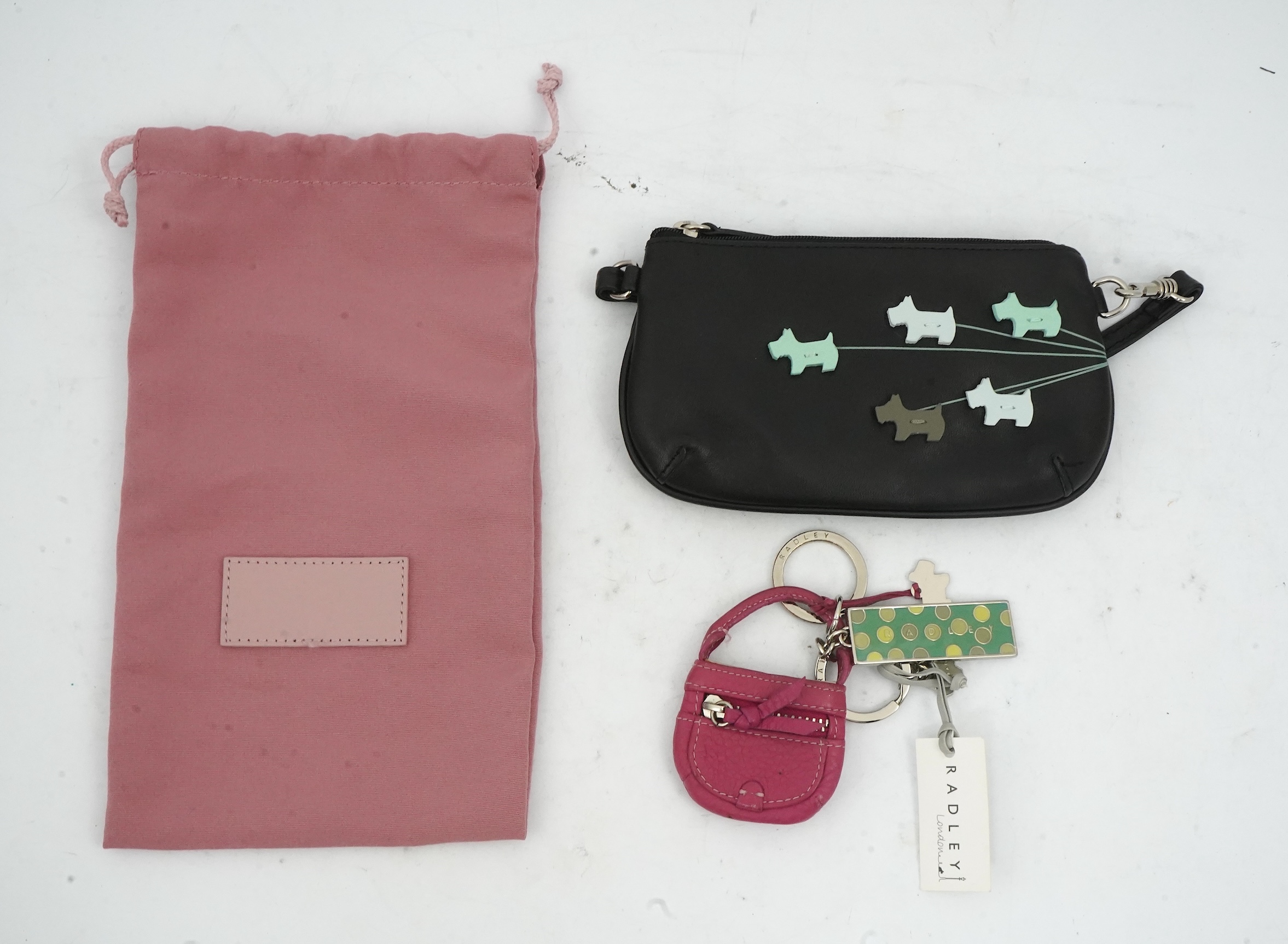 A Radley handbag, key fob and small bag.